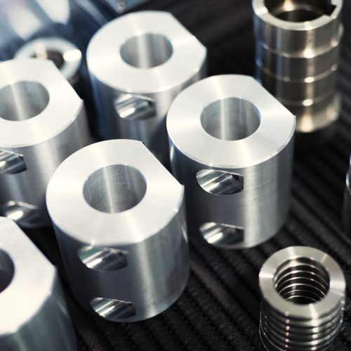 Close-up of a set of metallic gears and parts Close-up of a set of metallic gears and parts produced in metal factory